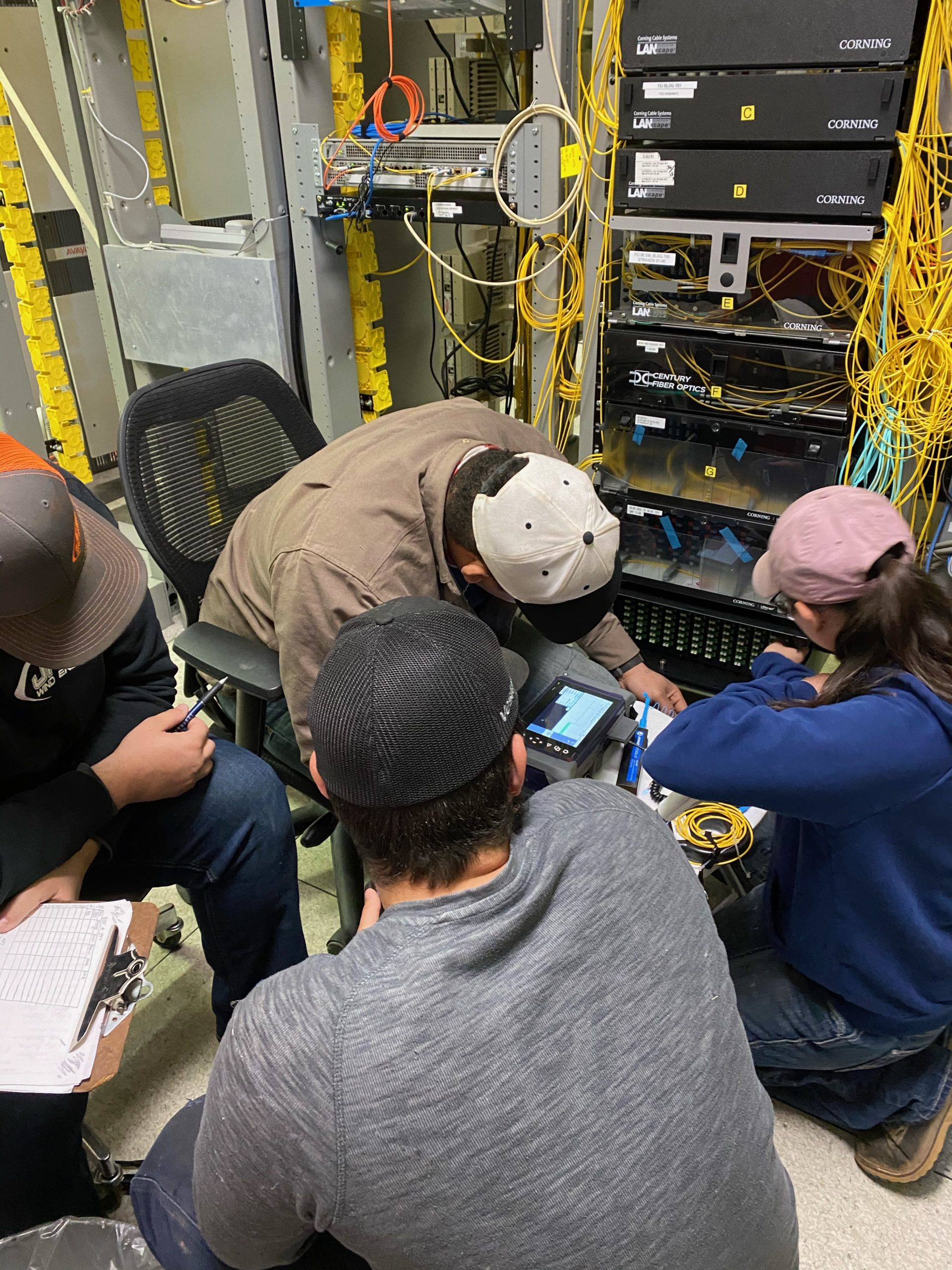people working on a electrical panel