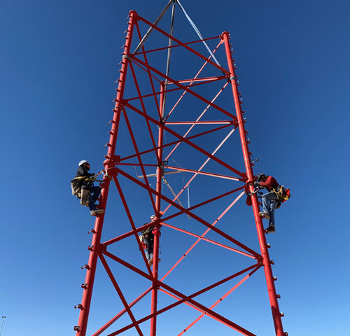 JMS Employees climbing tower
